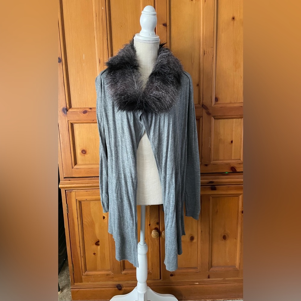 Jennifer Lopez grey sweater with faux fur neck line